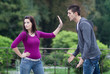 Couple fighting. Young man apologizing to his girlfriend