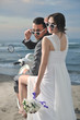 just married couple on the beach ride white scooter just married couple on the beach ride white scooter