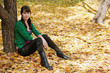 beautiful girl with dark hair resting in autumn park beautiful girl with dark hair resting in autumn park
