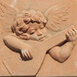 angel playing guitar in terracotta from tuscan Impruneta