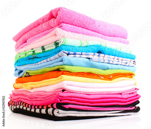 Photo: Pile of colorful clothes over white background Pile of colorful clothes over white background