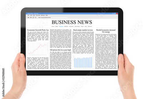 Photo: Reading News on Tablet PC Reading News on Tablet PC