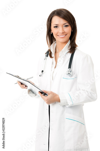Foto: Happy smiling female doctor writing on clipboard, isolated Happy smiling female doctor writing on clipboard, isolated