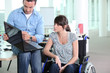 Young woman disabled with co-worker