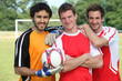 Football teammates posing
