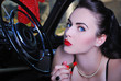 Beautiful pin up girl with lipstick in car Beautiful pin up girl with lipstick in car