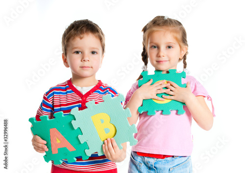 Photo: boy and girl holding letters boy and girl holding letters