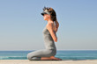Young girl making exercises on the beach Young girl making exercises on the beach