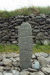 Ogham writing in an old Celtic cros,, Gallarus, Ireland
