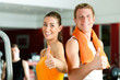 Photo: Sportive couple in gym Sportive couple in gym