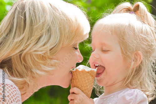 Photo: Mother with baby eating ice cream Mother with baby eating ice cream