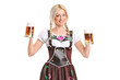 Blond woman with traditional costume holding beer glasses