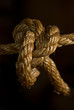 Closeup of tight note on old rope