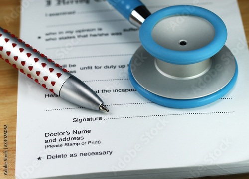 Photo: A Blue Stethoscope On A Doctors Desk A Blue Stethoscope On A Doctors Desk