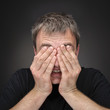 Confused young man in black T-shirt