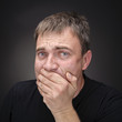 Foto: Confused young man in black T-shirt Confused young man in black T-shirt