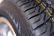 Low-profile car wheel on a white background close up