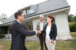 Real-estate agent with senior couple buying new house Real-estate agent with senior couple buying new house