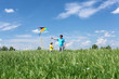 father with son in summer with kite