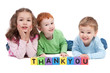 Three happy children with thankyou kids letter blocks Three happy children with thankyou kids letter blocks