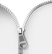 Photo: Opened zipper revealing a white background Opened zipper revealing a white background