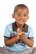 Three year old black or african american boy playing with blocks Three year old black or african american boy playing with blocks