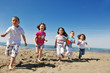 happy child group playing  on beach