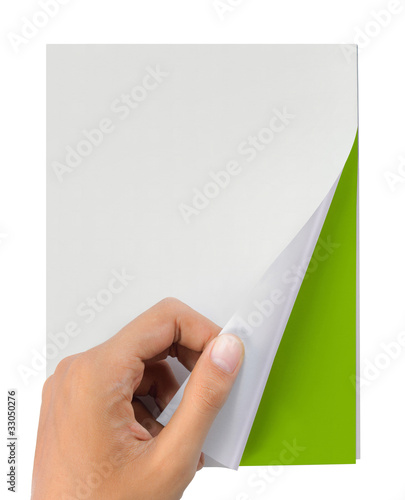 Photo: hand turn page of magazine isolated on white hand turn page of magazine isolated on white