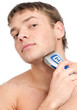 Portrait of a young handsome man shaving