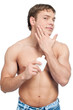 Man putting on cream lotion