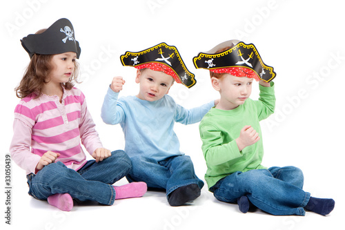 Photo: Children playing game in kids party pirate hats Children playing game in kids party pirate hats