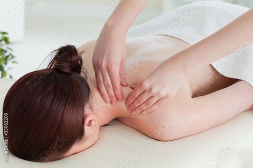 Photo: Red-haired woman having a rolling massage Red-haired woman having a rolling massage