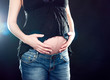 pregnant woman caressing her belly