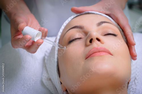 Photo: pretty woman getting special skin treatment at beauty salon pretty woman getting special skin treatment at beauty salon