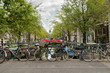 Bikes parked on a bridge in Amsterdam, Netherlands Bikes parked on a bridge in Amsterdam, Netherlands