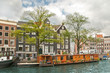 House boat in Amsterdam channel, Netherlands