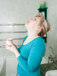 woman with glass in bath