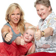 Photo: Portrait of a smiling family showing thumps up Portrait of a smiling family showing thumps up