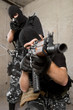 Soldiers in black masks with weapons