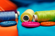 Photo: colorful sewing thread reels and buttons colorful sewing thread reels and buttons