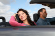 Couple riding convertible car
