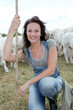 Portrait of breeder standing in farmland