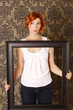 Red head with picture frame