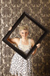 Woman with picture frame