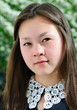 Asian Girl front of spring blossom