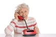Photo: The elderly woman speaks on phone The elderly woman speaks on phone