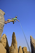 Rock climber rappelling.