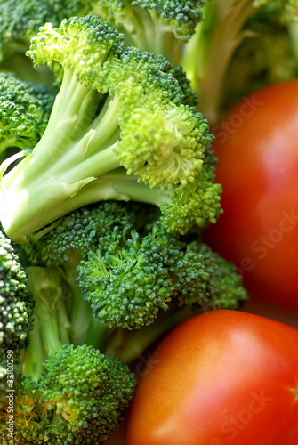 Photo: Broccoli and mature tomato. Broccoli and mature tomato.