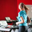 Photo: Gym exercising. Run on on a machine. Gym exercising. Run on on a machine.