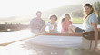 Family in rowboat on lake
